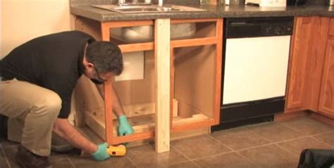 fix scratch on cabinet steel|repairing bottom of kitchen cabinet.